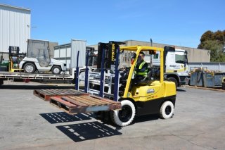 forklift with multi load attachment action